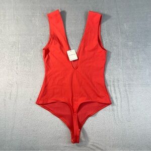 Free People Keep It Sleek Bodysuit NWT XS Pink Poinsettia One-Piece Chic